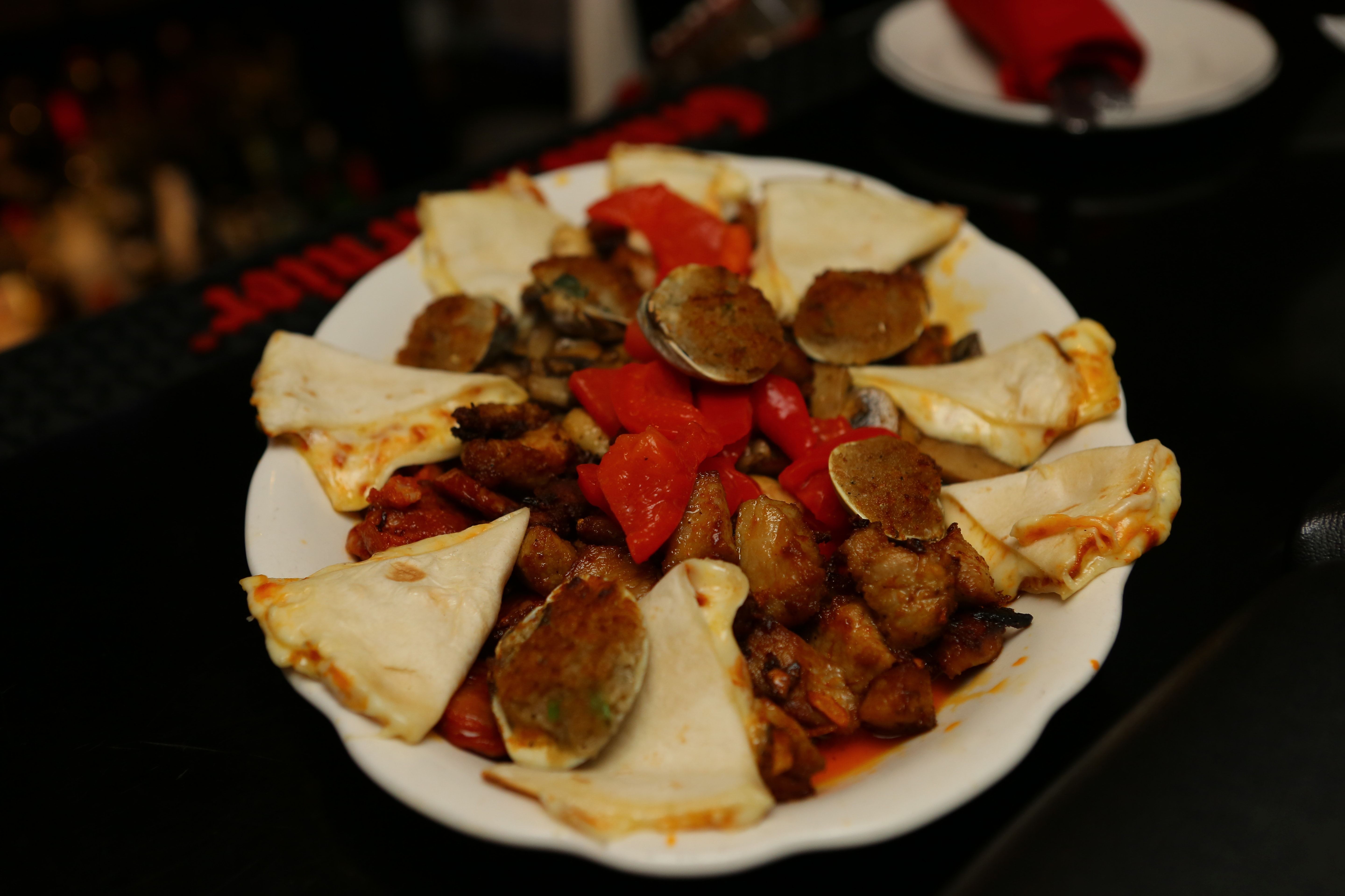 Clams, peppers and tapas on a plate