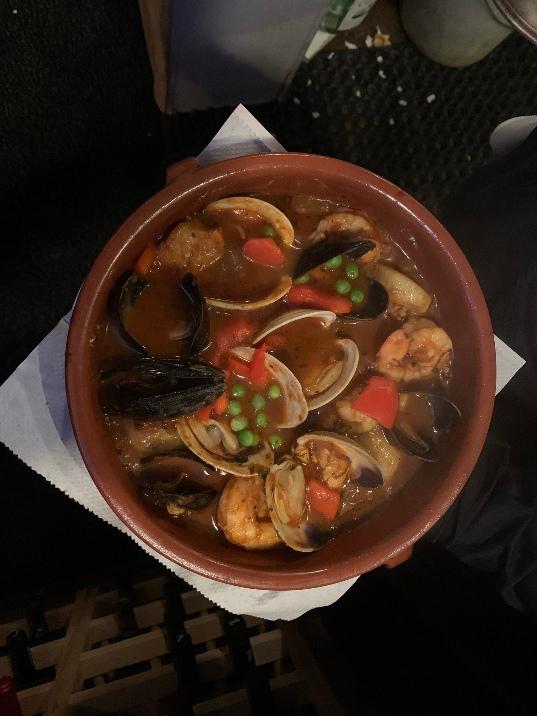 Zarzuela: seafood stew with clams, mussels and shrimp in a clay cazuela